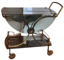 JANSEN Desserte ( bar roulant ) en laiton et bronze doré à plateaux rabattables