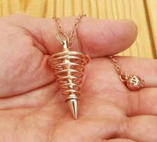 *° PENDULE  7 SPIRALES CUIVRE