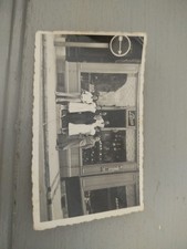 Photo amateur devanture commerce à identifier Horloger Lebas Armurerie années 30