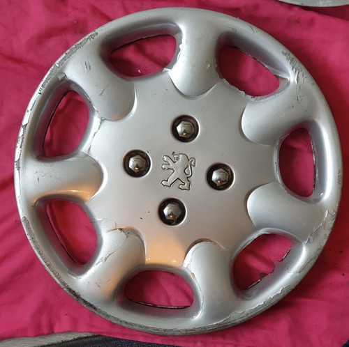 Enjoliveur peugeot 306 - un,