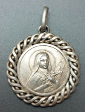 Médaille religieuse métal argenté années 30 "Sainte Thérèse de l'Enfant Jésus"