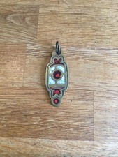 Pendentif bronze dominique