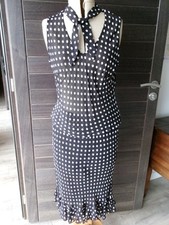 ensemble femme M , haut et jupe noir à poids blancs