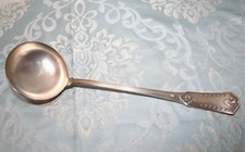 louche ancienne en métal