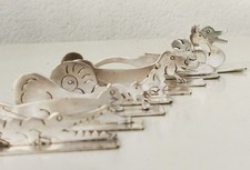 Lot de 8 portes couteaux animaux art déco en métal argenté