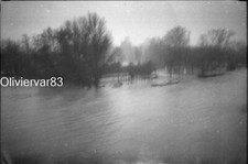 Vintage photo negative mistake motion blur, fog - flooded woods by a river