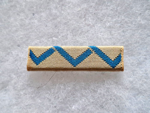 Une barrette médaille - barrette,