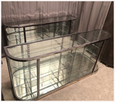 Paire de vitrines anciennes de magasin, laiton chromé et verre bombé OLLIER