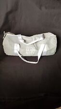 Sac de sport Guerlain Gris et blanc Inscription " The ideal Man Myth or reality?