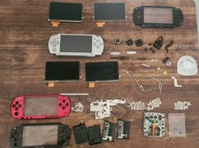 Lot PSP 2004 grise écran HS + pièces (écrans, boutons, coques, lecteur UMD)