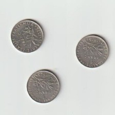 trois pièces de un franc de
