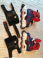 Patin a roulette marque Oxelo Pointure 30 a 32 avec housse et protection main