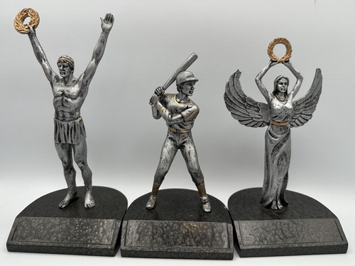 Three pewter like figurines - like,