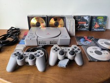 lot Console PS1 SCPH 7502 Pucée + 2 manettes + 4 cartes mémoires + Nombreux jeux