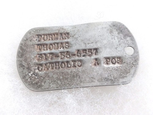 Une plaque identité militaire