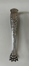 Pince à sucre en métal argenté style Louis XV pattes de Lion