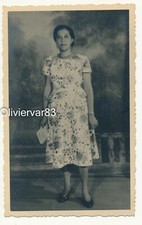 Vintage photo - Asian woman in flower dress portrait with a book