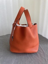 HERMÈS Basket with orange