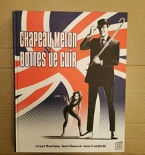 Chapeau melon & bottes de cuir