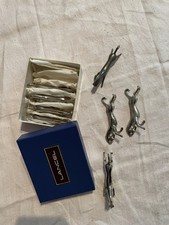 ENSEMBLE DE 8 PORTE-COUTEAUX EN METAL ARGENTE MODELE CHEVAUX