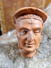 Pipe terre cuite sculptée - en,
