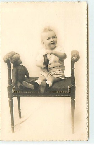 Toy baby sitting on - -,