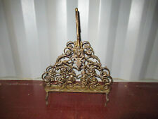 ANCIEN PORTE REVUES A VOLUTES EN BRONZE 