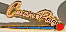 Pin's CUISINE PRATIQUE Signé
