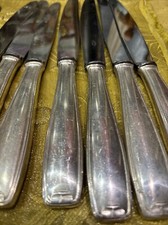 8 couteaux metal argenté