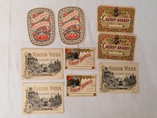 Lot 9 étiquettes Plouviez : Cherry Brandy, Kirsch Vieux, Kirsch Fantaisie - 1950