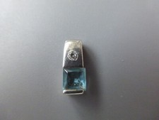 pendentif argent poinçon 925 et testé, 2,65gr 1.5x0,7cm zirconium blanc, topaze