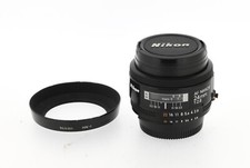 Nikon af  Nikkor 24 mm 2.8 numéro 205069 avec son pare-soleil HN-1
