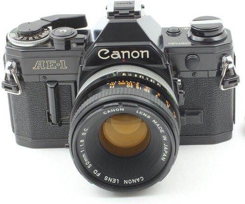 Canon black 35mm slr - ae-1, film