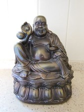 Hotei laughing fat man statue