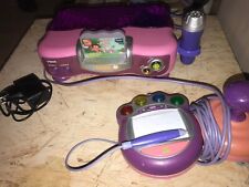 console vsmile rose avec jeux dora vf testée et fonctionelle