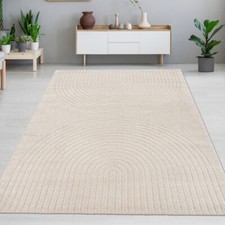 Tapis de salon doux avec un motif arqué simple en beige