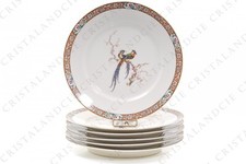 Six assiettes plates aux
