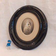 Cadre ovale noir ancien