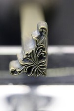 FER   A  DORER  DE  RELIEUR  PETIT  ANGLE   ÉPOQUE  19 ÈME  EMPIRE  N° 2