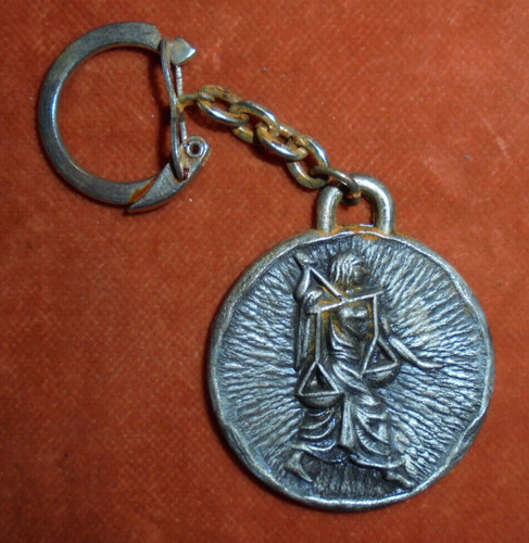 Porte clés métal - métal, signe
