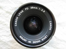 Canon 28 mm f 2,8 FD : monture à baïonnette Canon FD  New. Avec ses bouchons.
