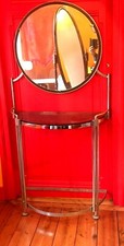 coiffeuse miroir rond ossature métal chromé dessus verre teintée . XX siècle .