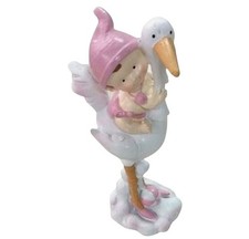 Figurine sujet baptême -Bébé fille sur cigogne -Résine rose et blanche H 14,5 cm