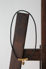 Hermès collier à breloque coeur cadenas plaqué or