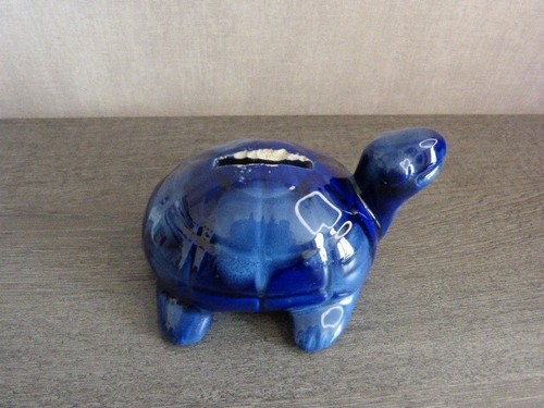Turtle breaking piggy bank - breaking, in