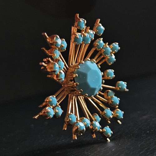 Broche étoile rayonnante