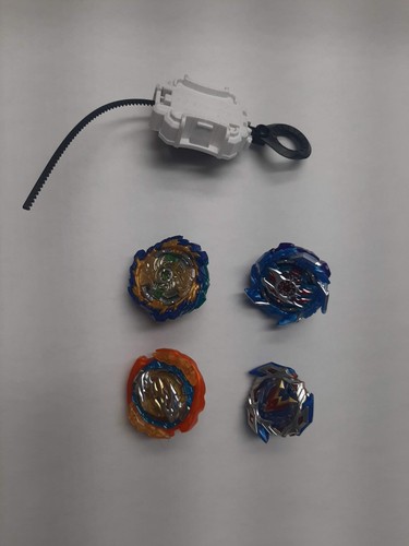 Beyblades and launcher - 4,