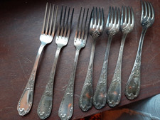 7 fourchettes en metal argente