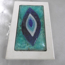 plaquette oeil en verre de murano sur bois