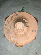 joli porte aiguille tête